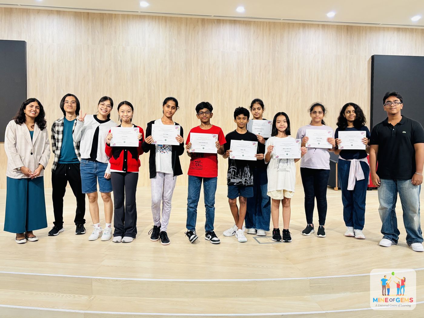 Camp participants holding certificates at the closing