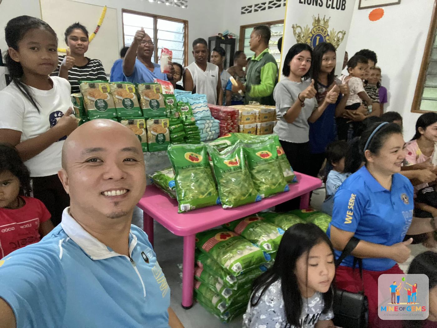 Greg with volunteers preparing food aid