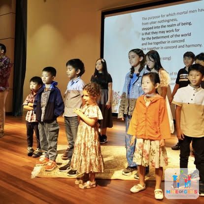 Children presenting together on stage
