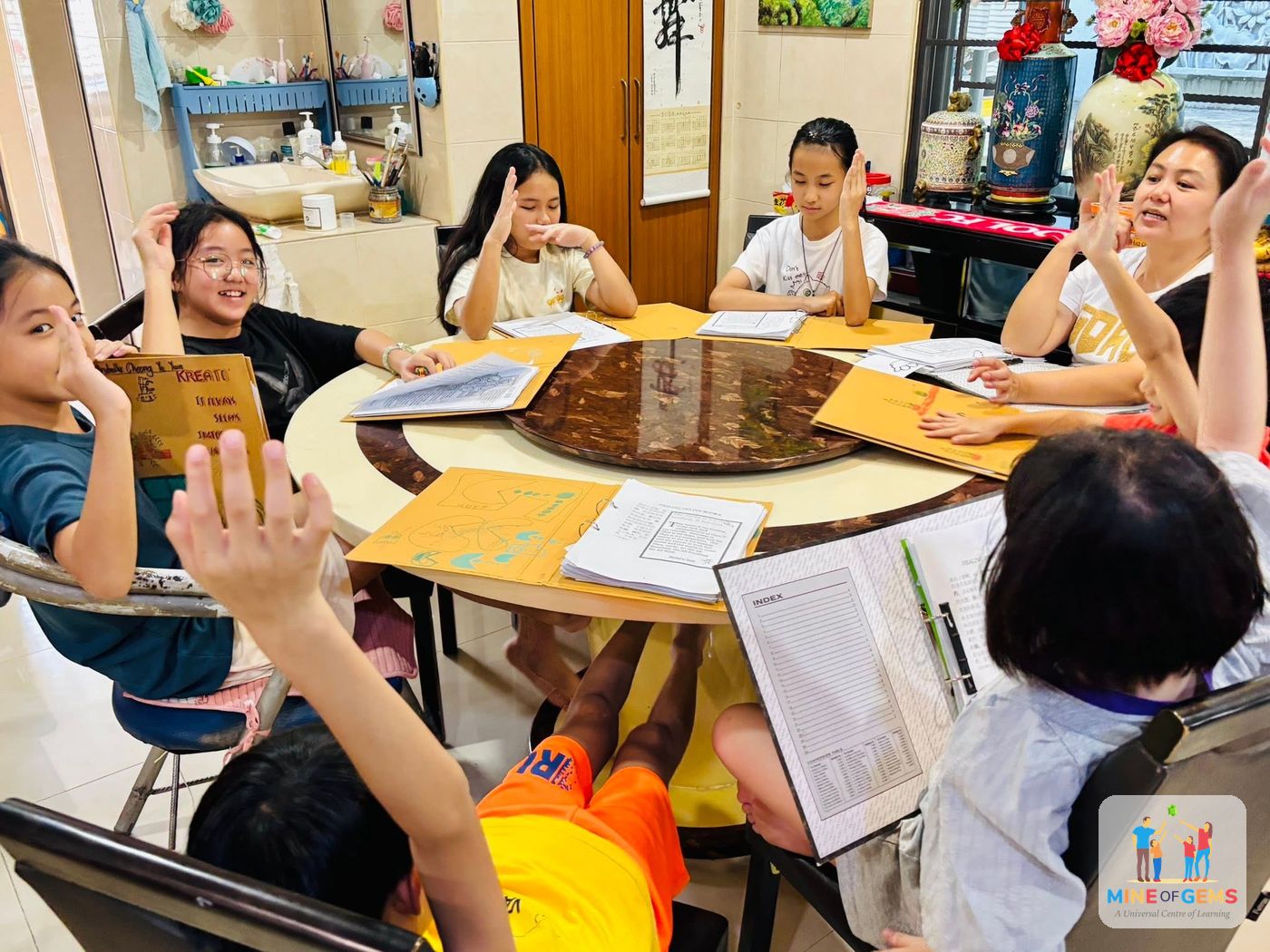 Children reading and studying together around a round table
