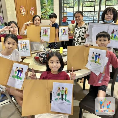 Children showing the pictures they drew