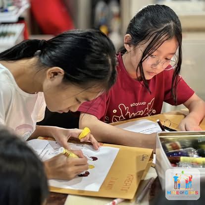 Two girls drawing together