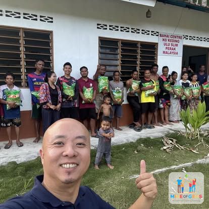 Greg with community members after a service visit