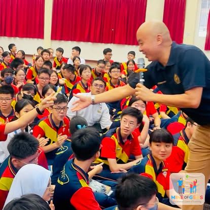 Greg engaging students during a school talk