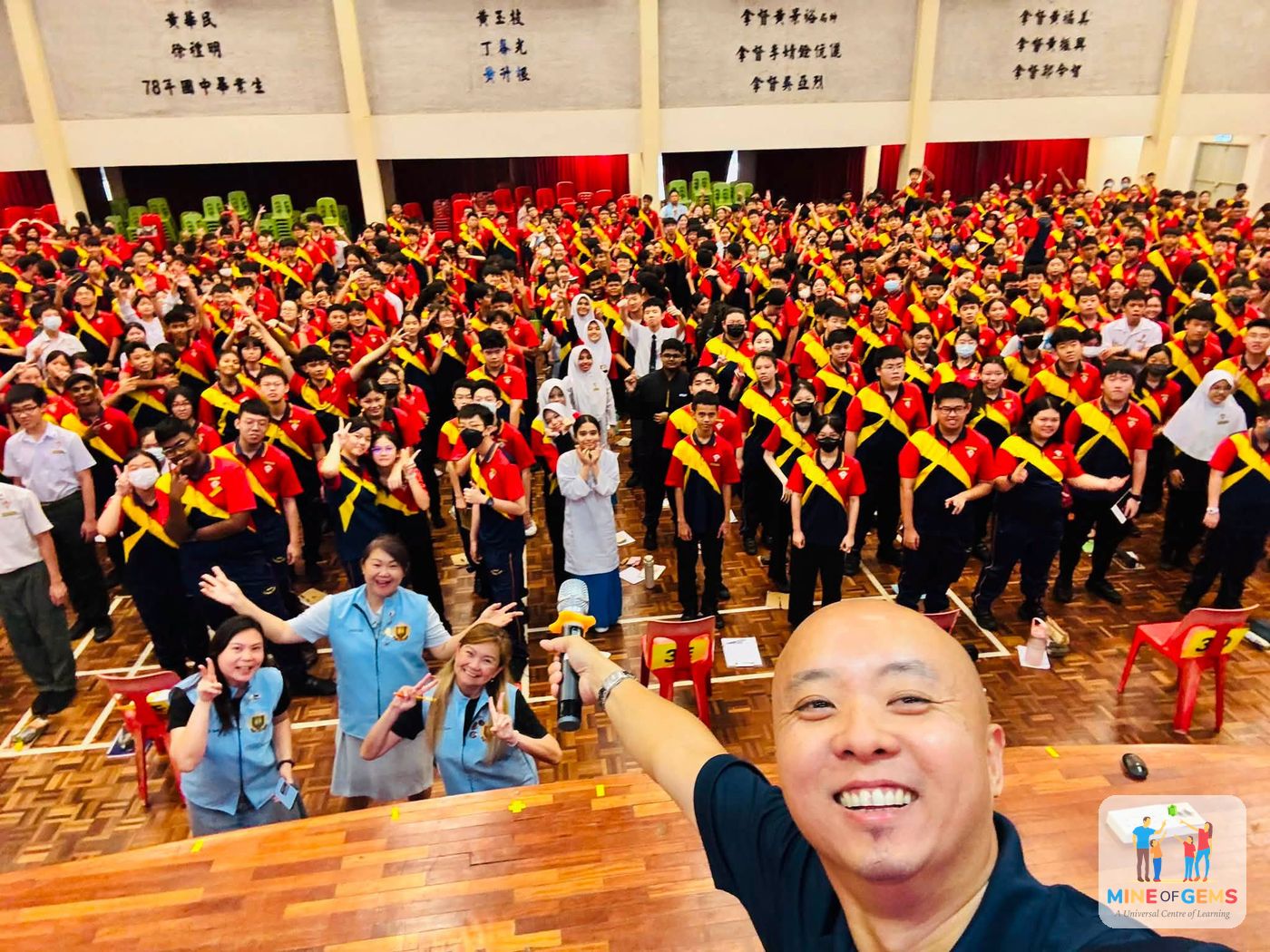 Greg with a hall full of students after a school talk
